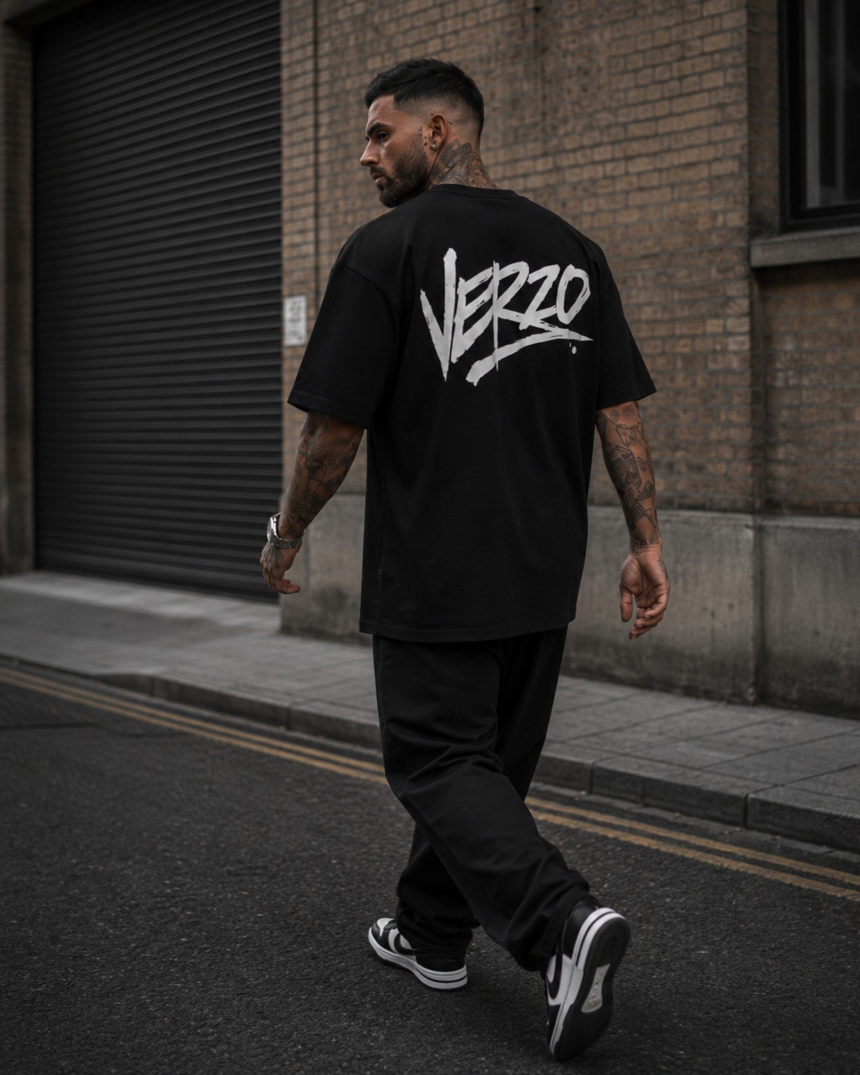 VERZO black sample T-shirt with large white back print on a streetwear model